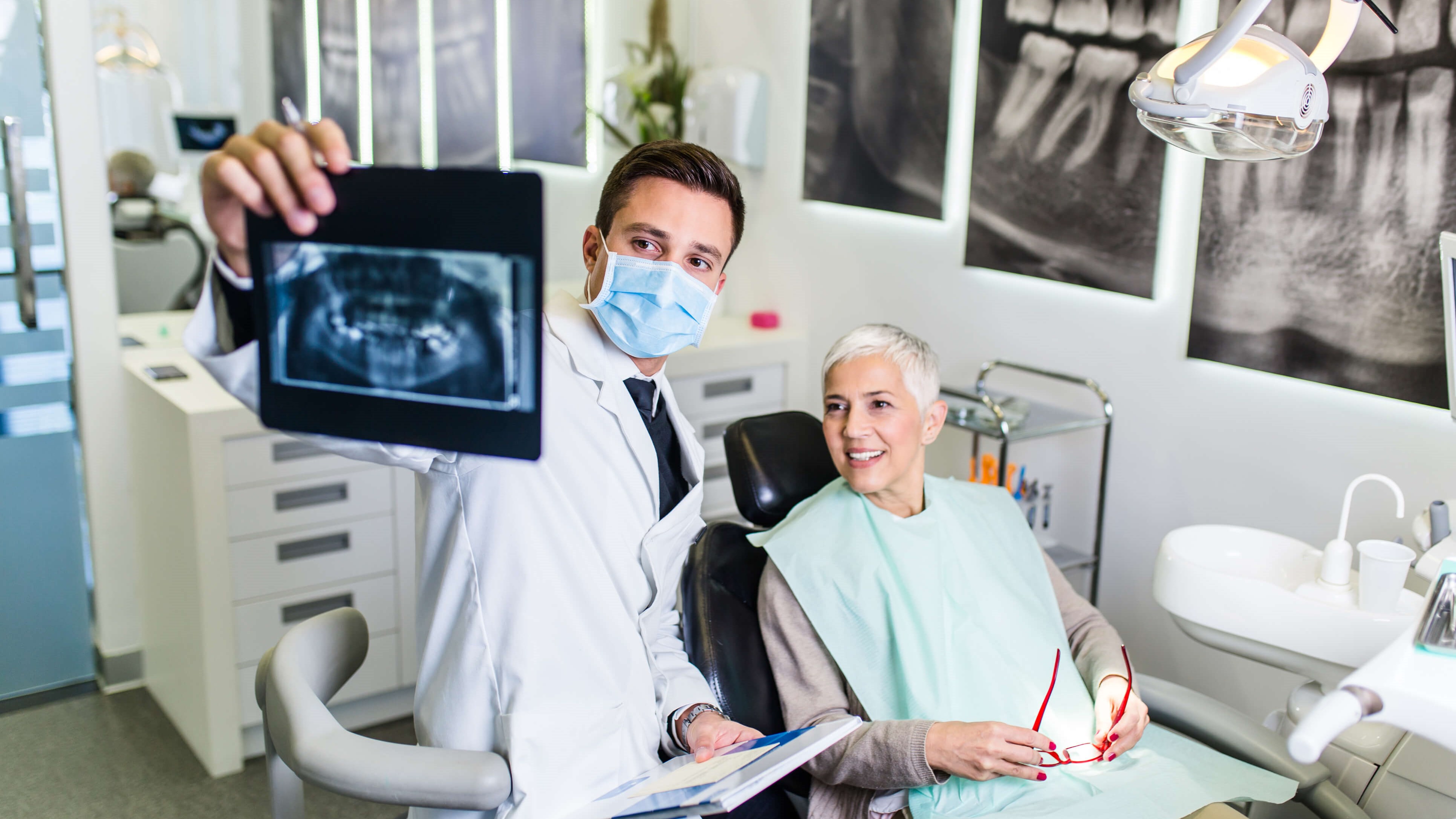 female dental patient with den